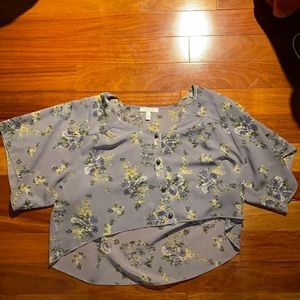 Delia’s light purple flowered blouse